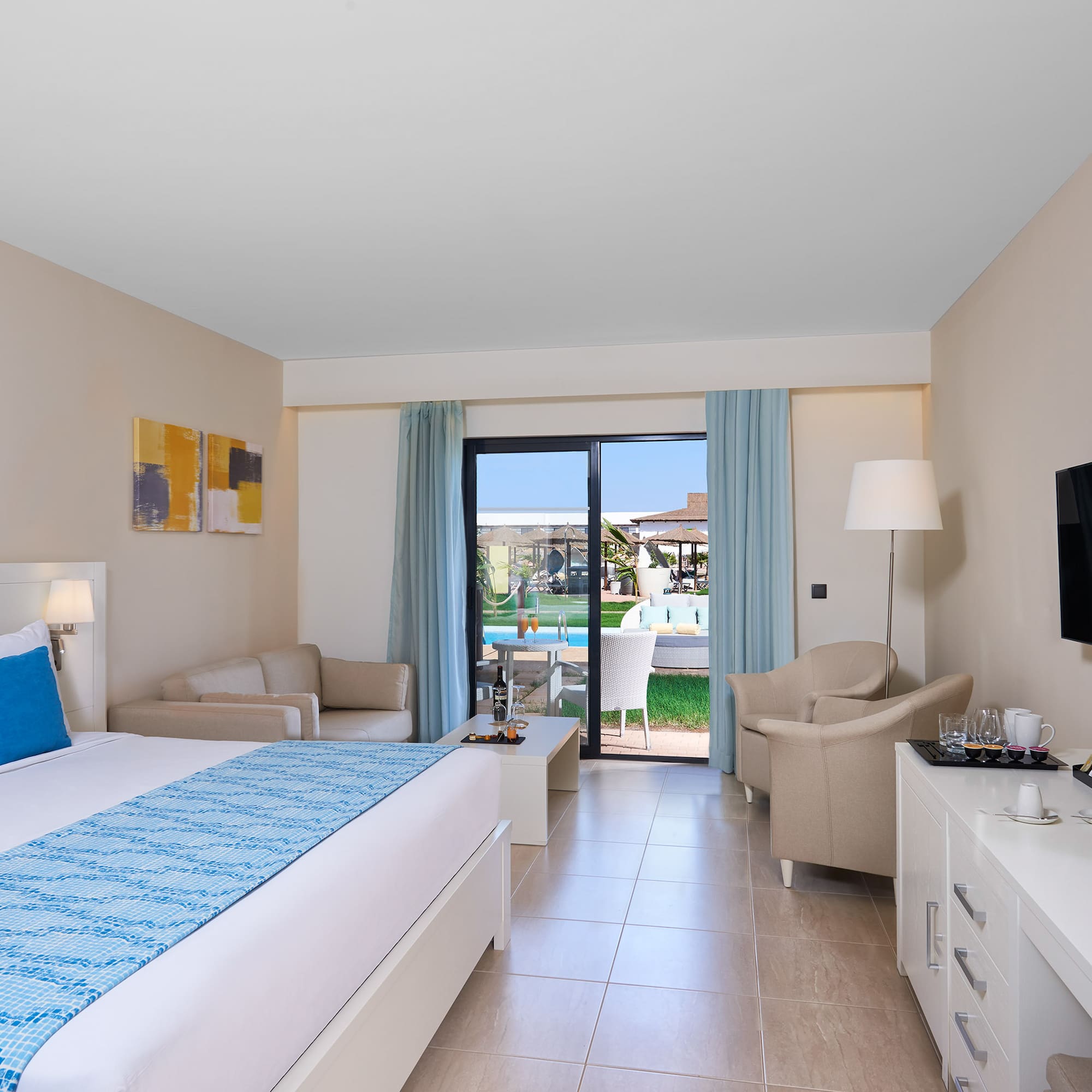 a room with a bed and a television