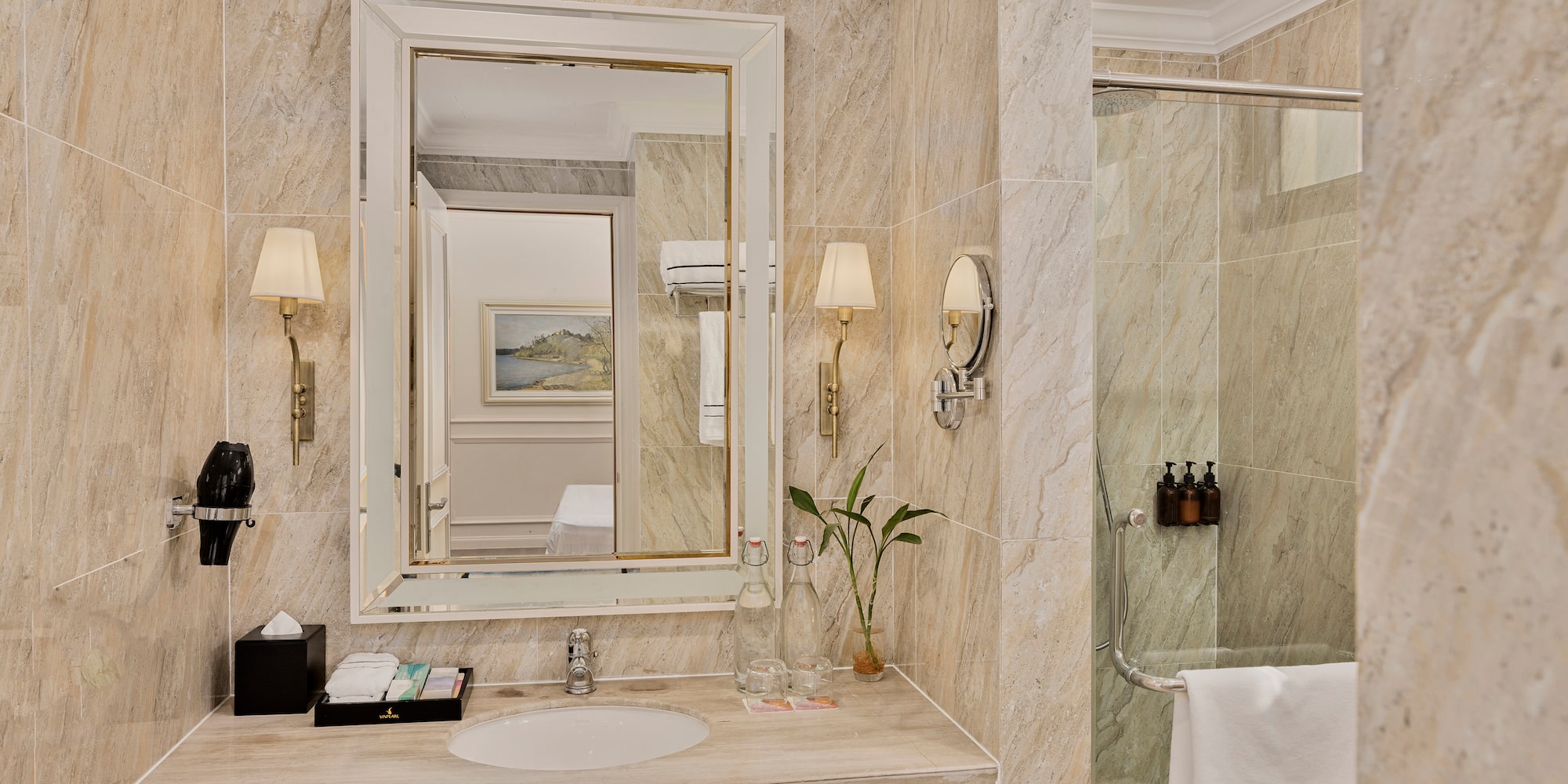 a bathroom with a mirror and a shower