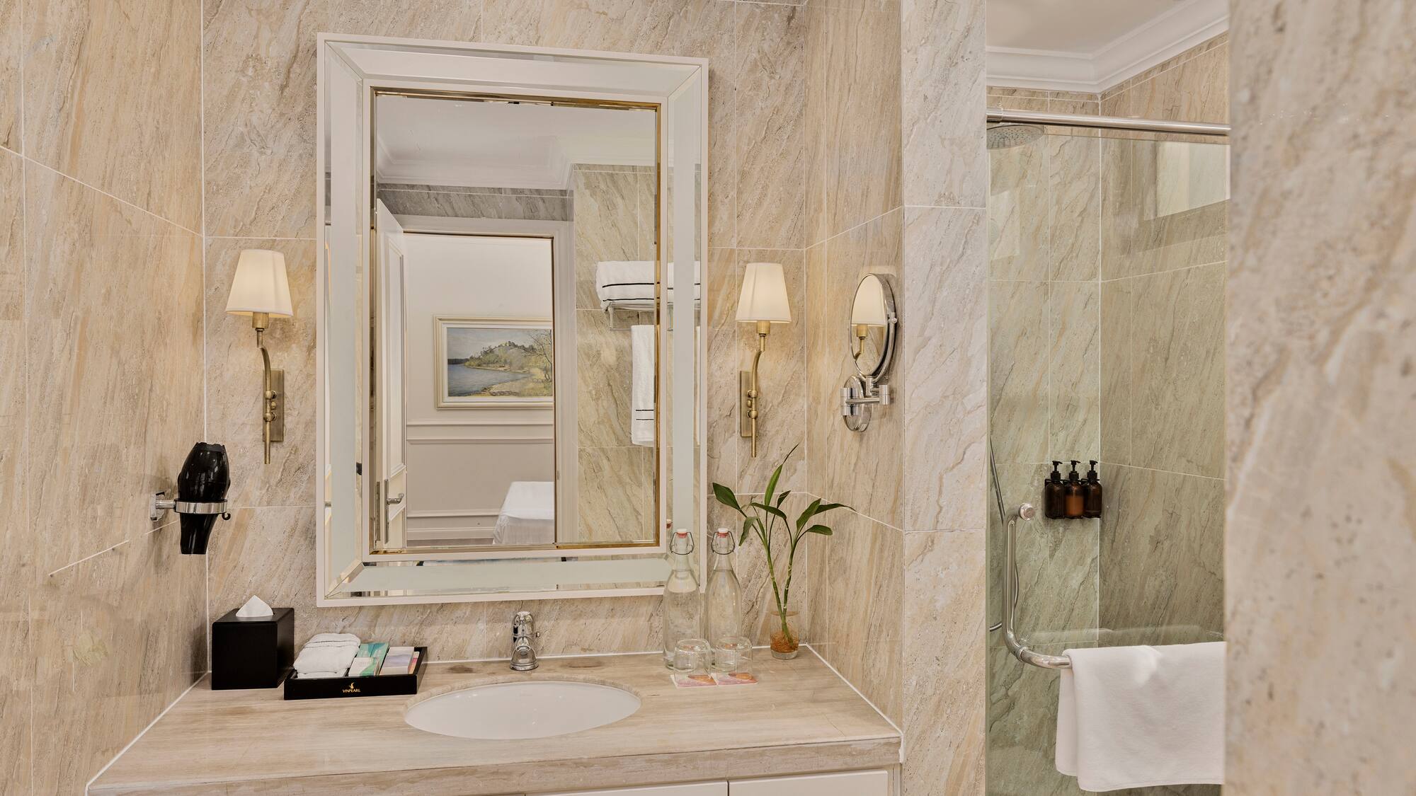 a bathroom with a mirror and a shower