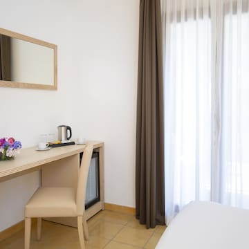 a room with a desk and a mirror
