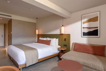 a room with a bed and a couch.