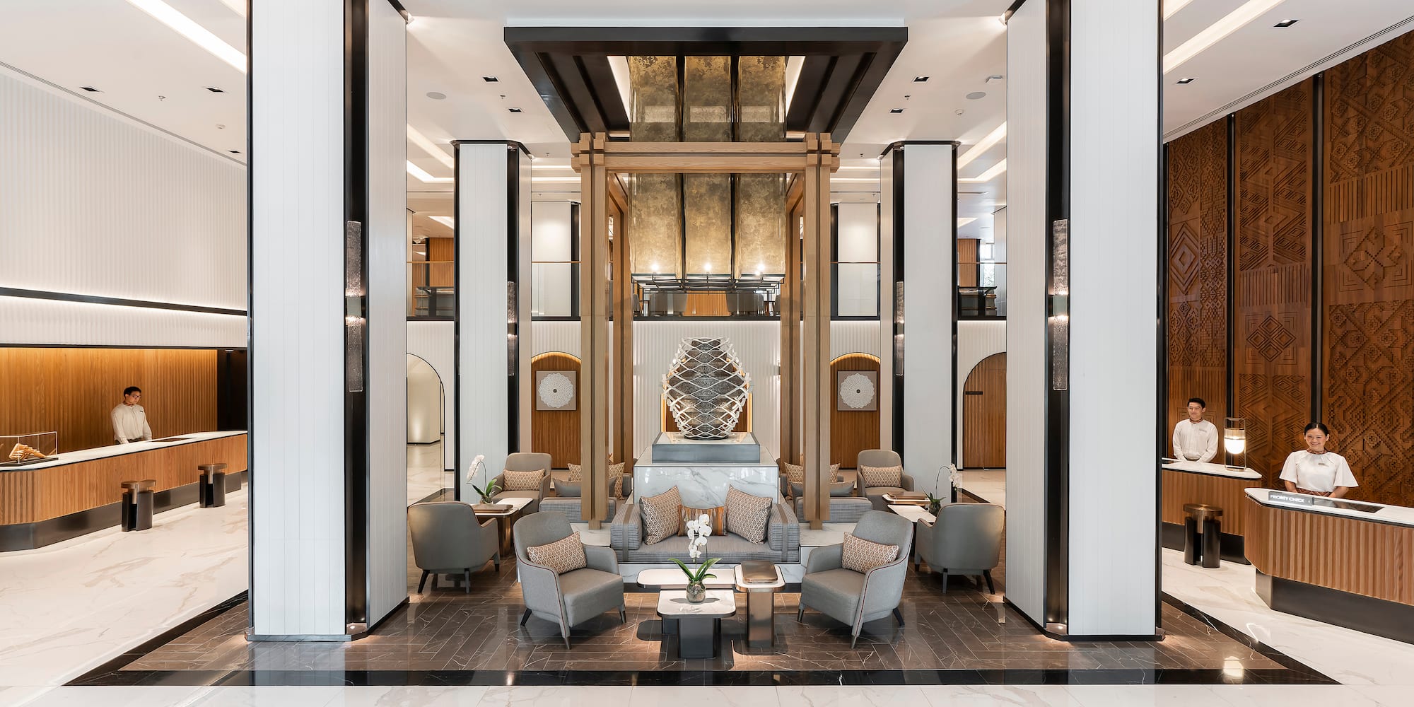 a lobby with a large statue of a cat