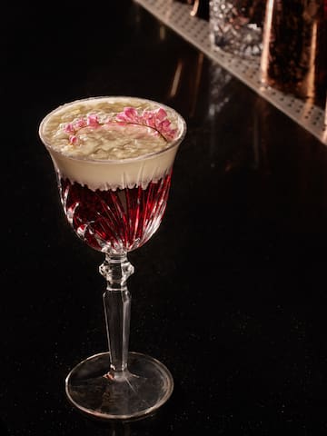 a glass with a drink in it