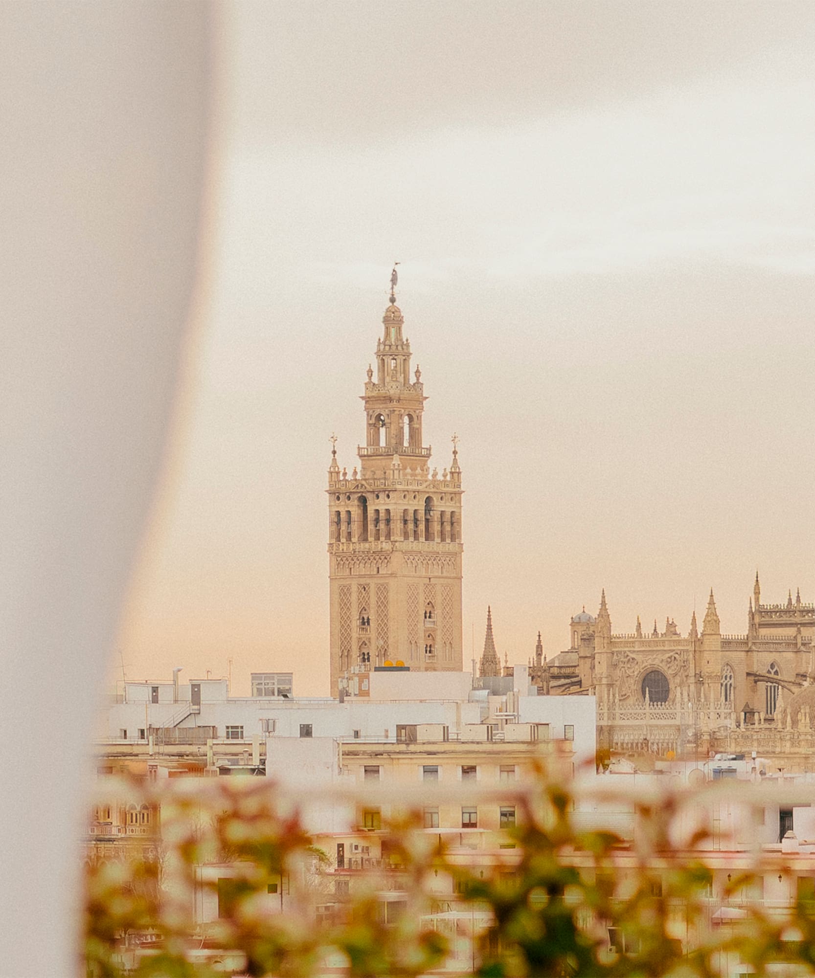a tall building with a tower in the background