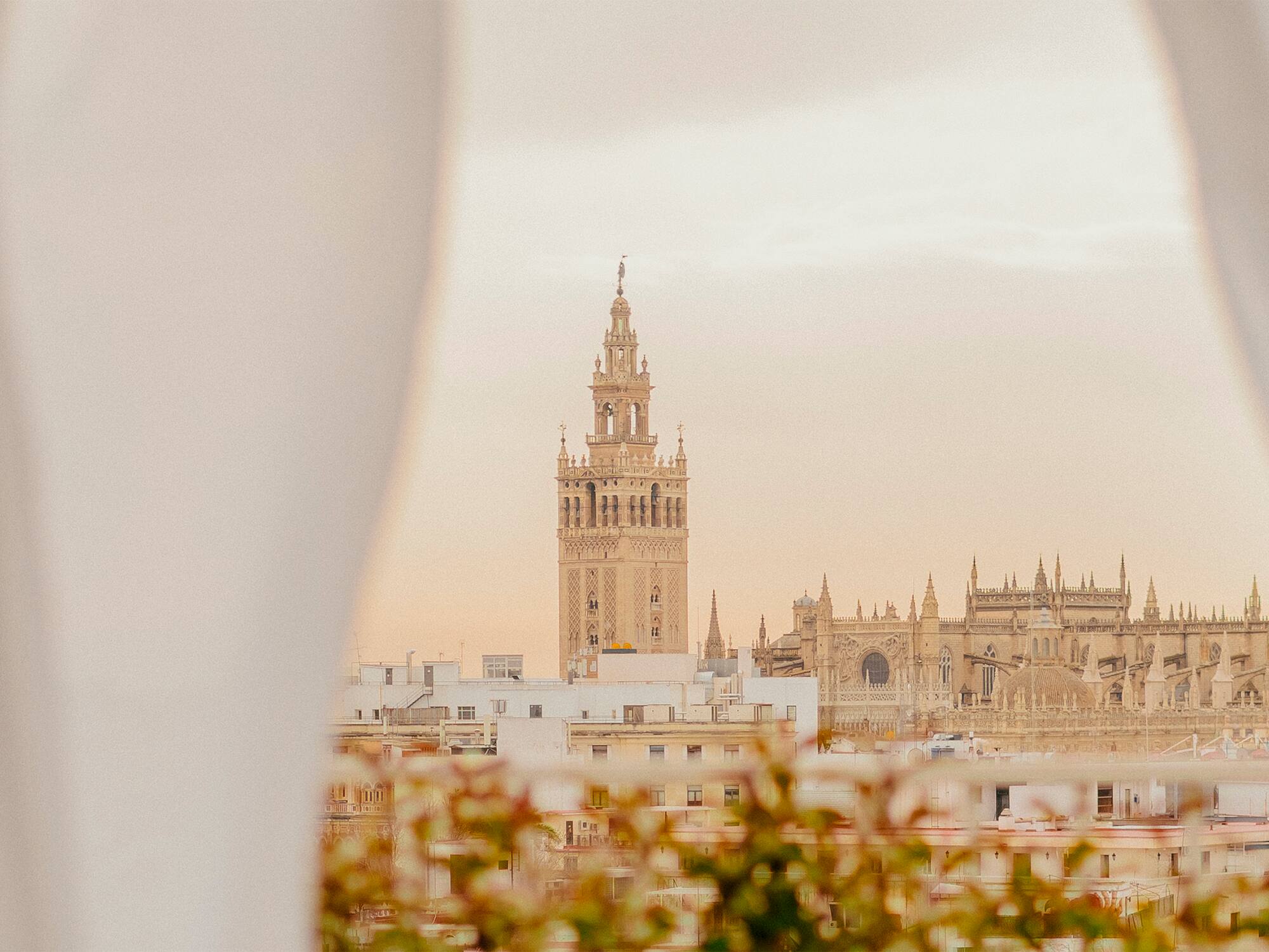 a tall building with a tower in the background