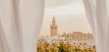 a tall building with a tower in the background