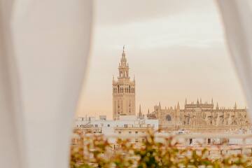 a tall building with a tower in the background