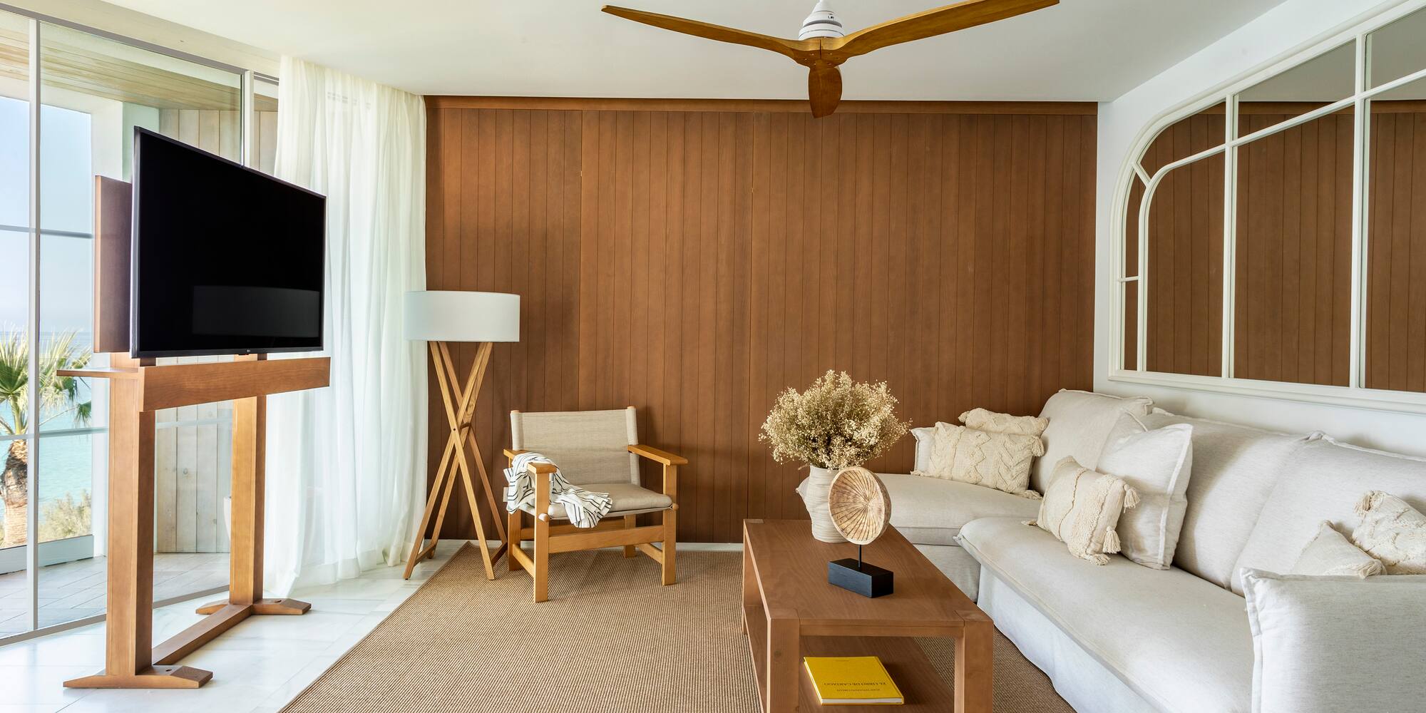 a living room with a television and a couch