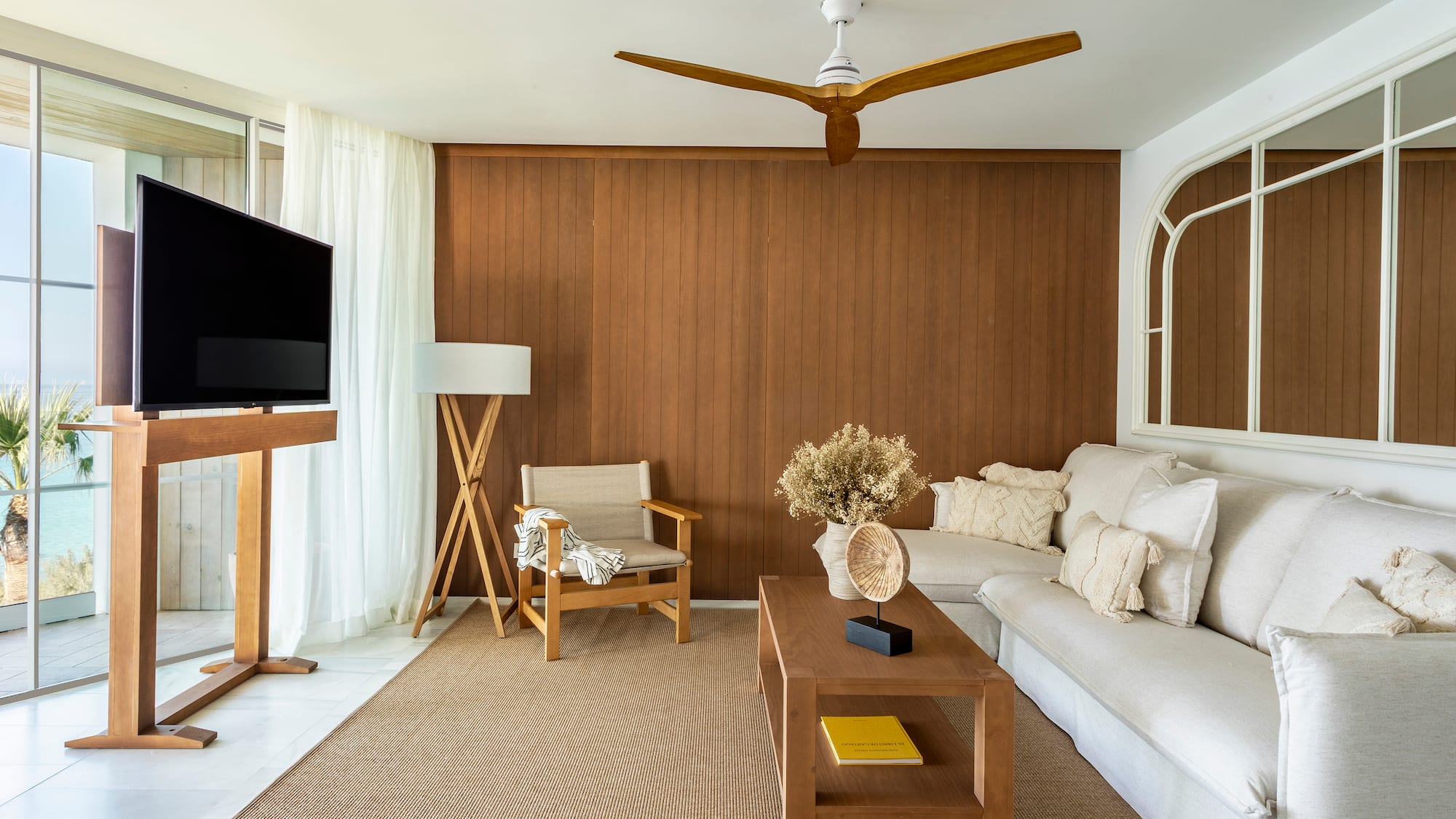 a living room with a television and a couch