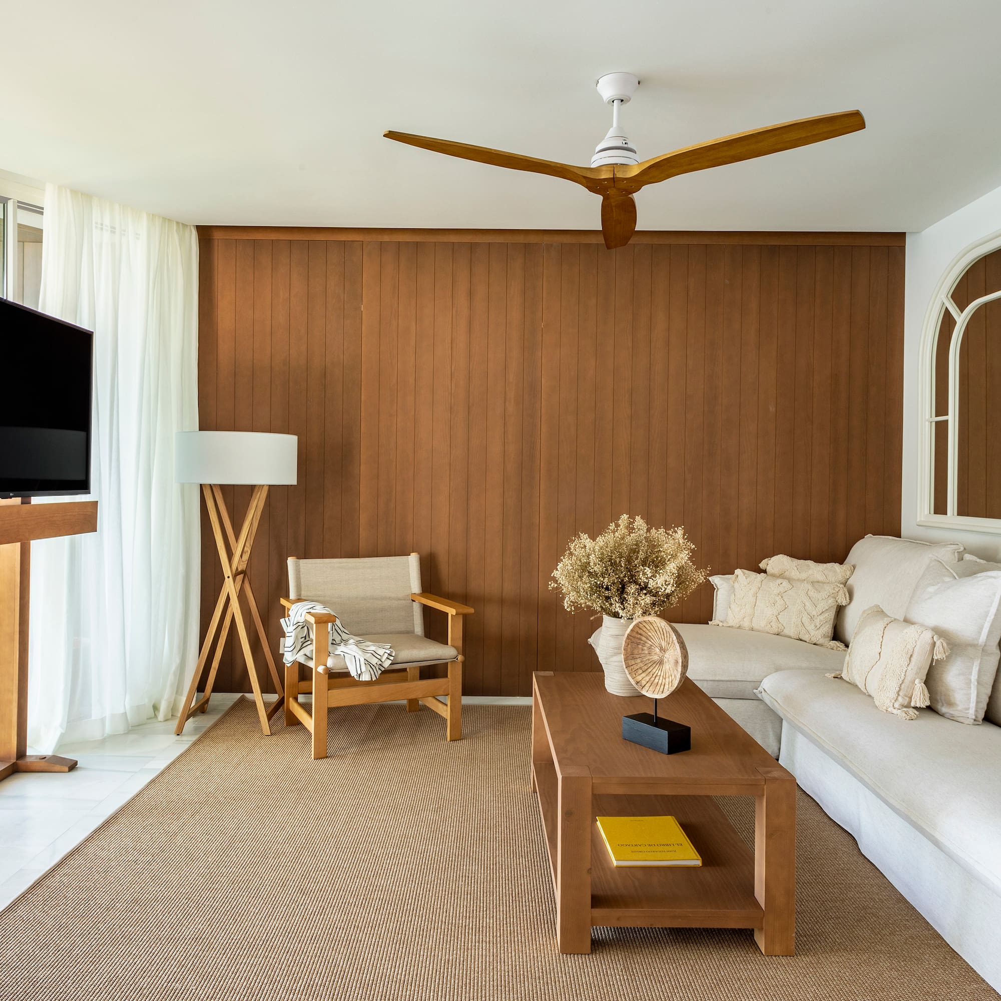 a living room with a television and a couch
