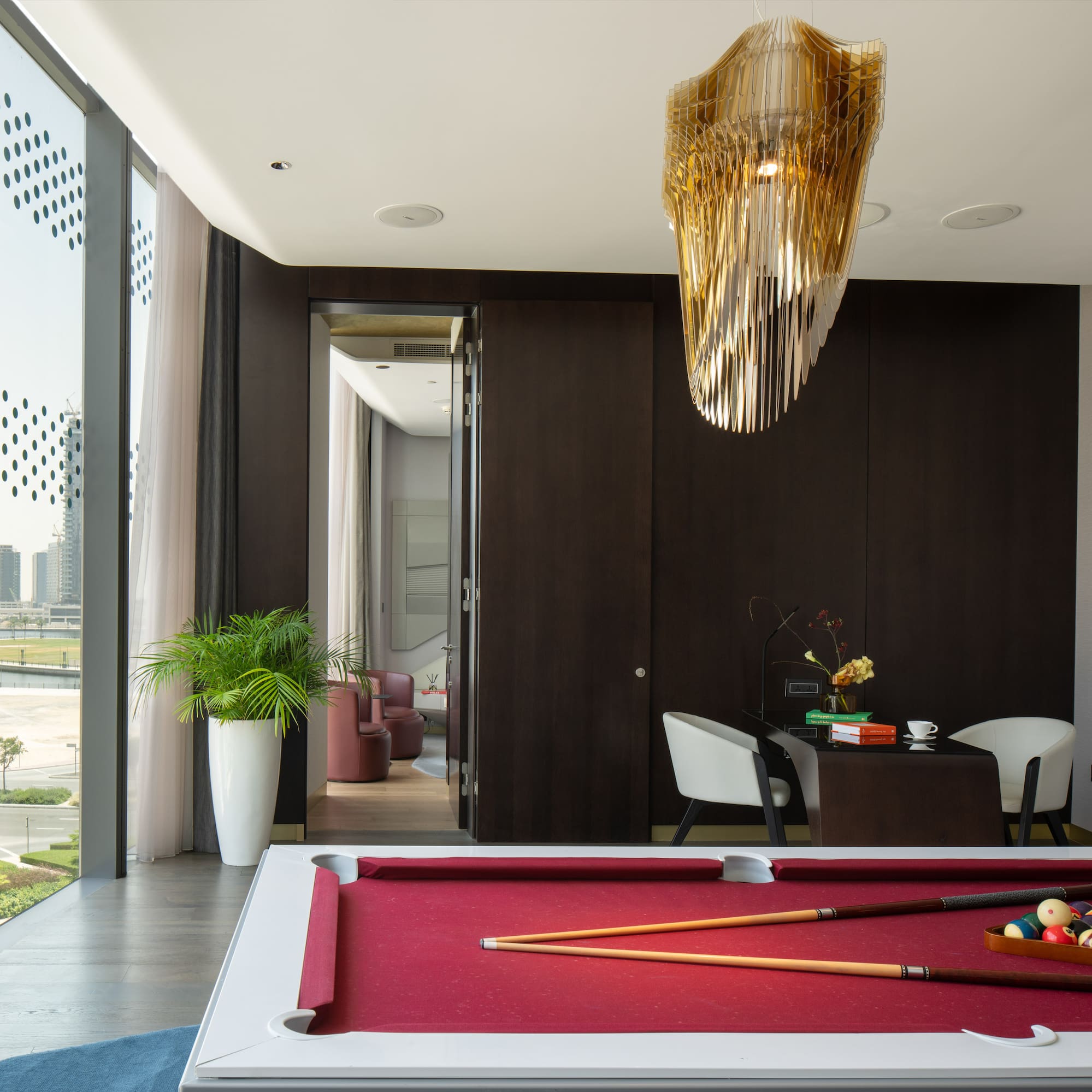 a pool table with a pool cue and a pool stick in it