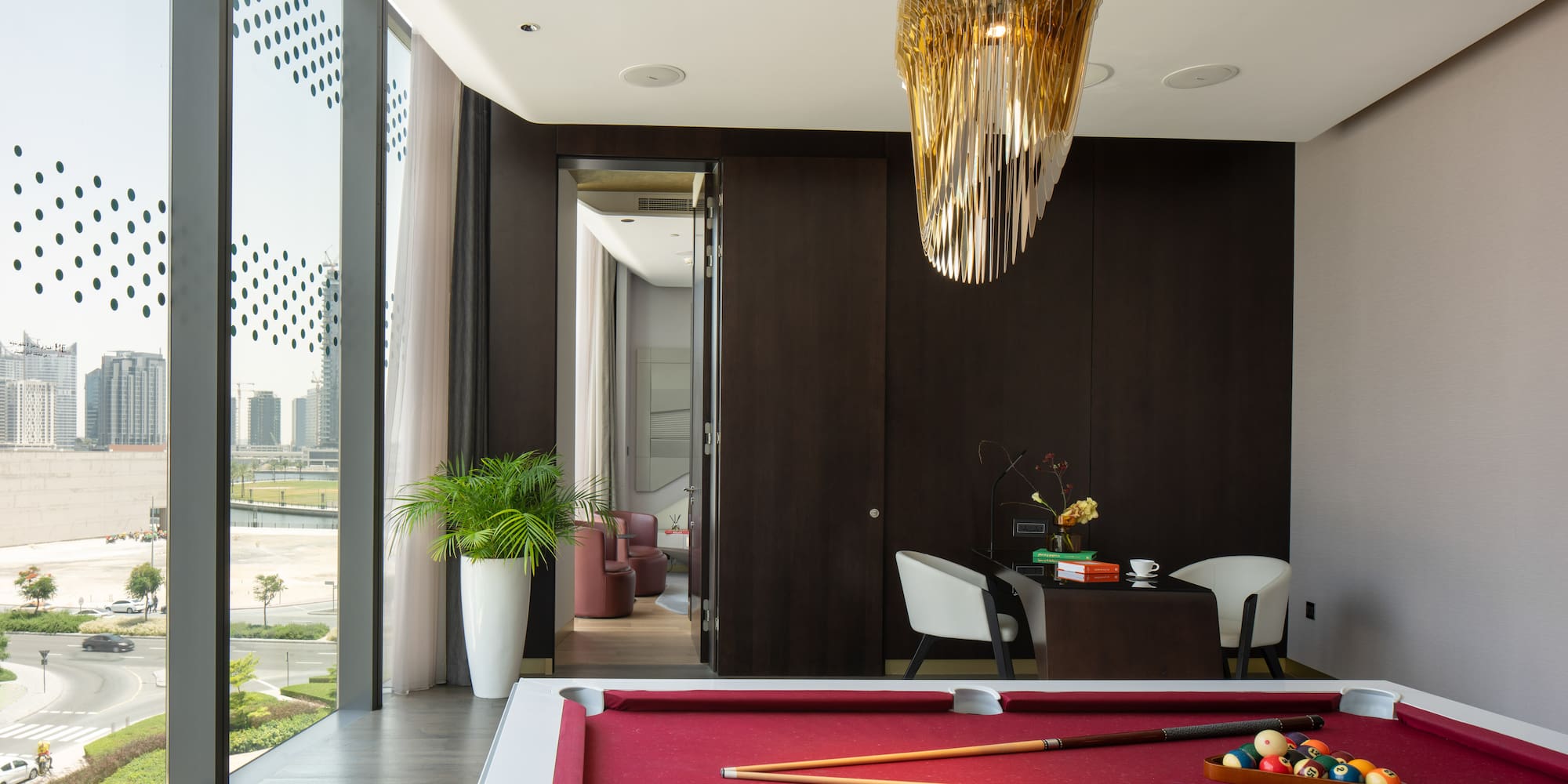 a pool table with a pool cue and a pool stick in it