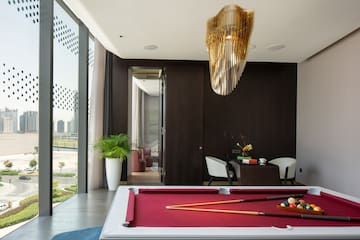 a pool table with a pool cue and a pool stick in it