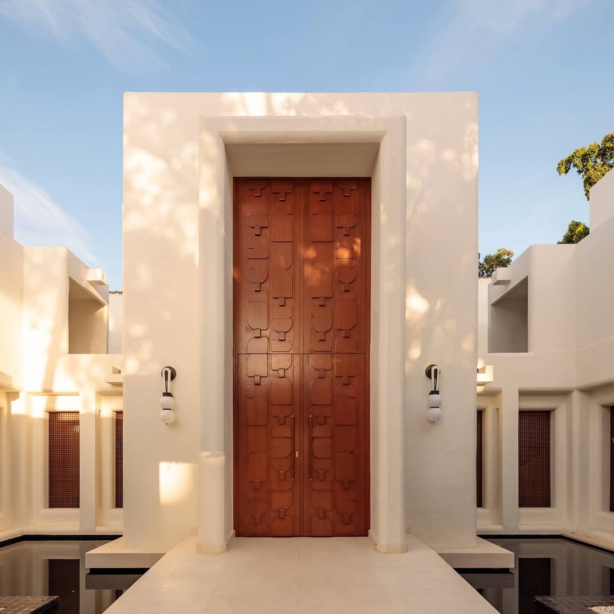 a white building with a brown door
