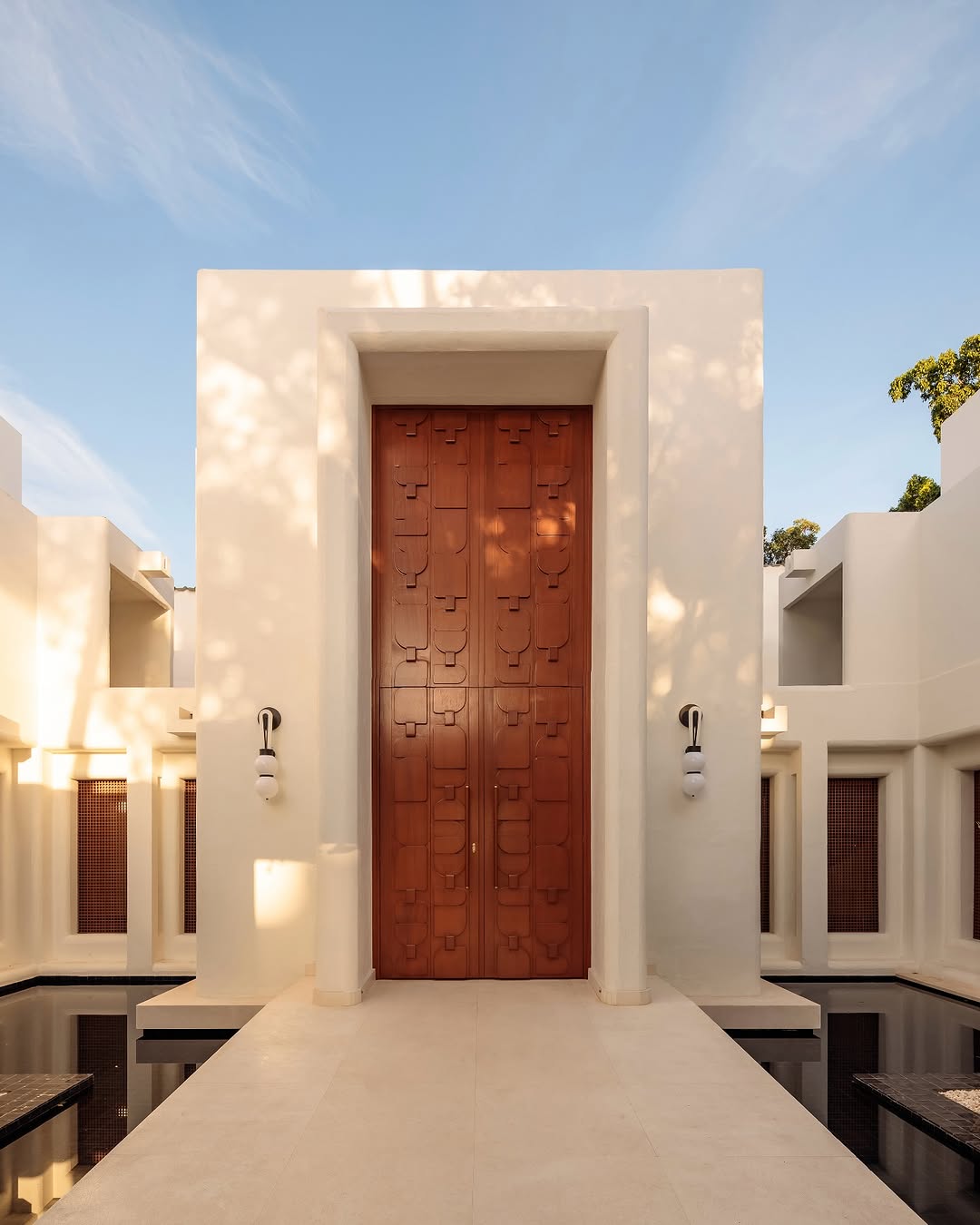 a white building with a brown door