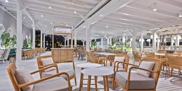 a room with chairs and tables