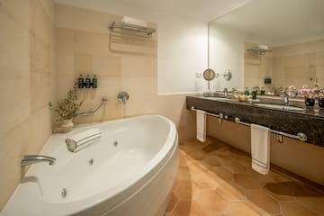 a bathroom with a tub and sink
