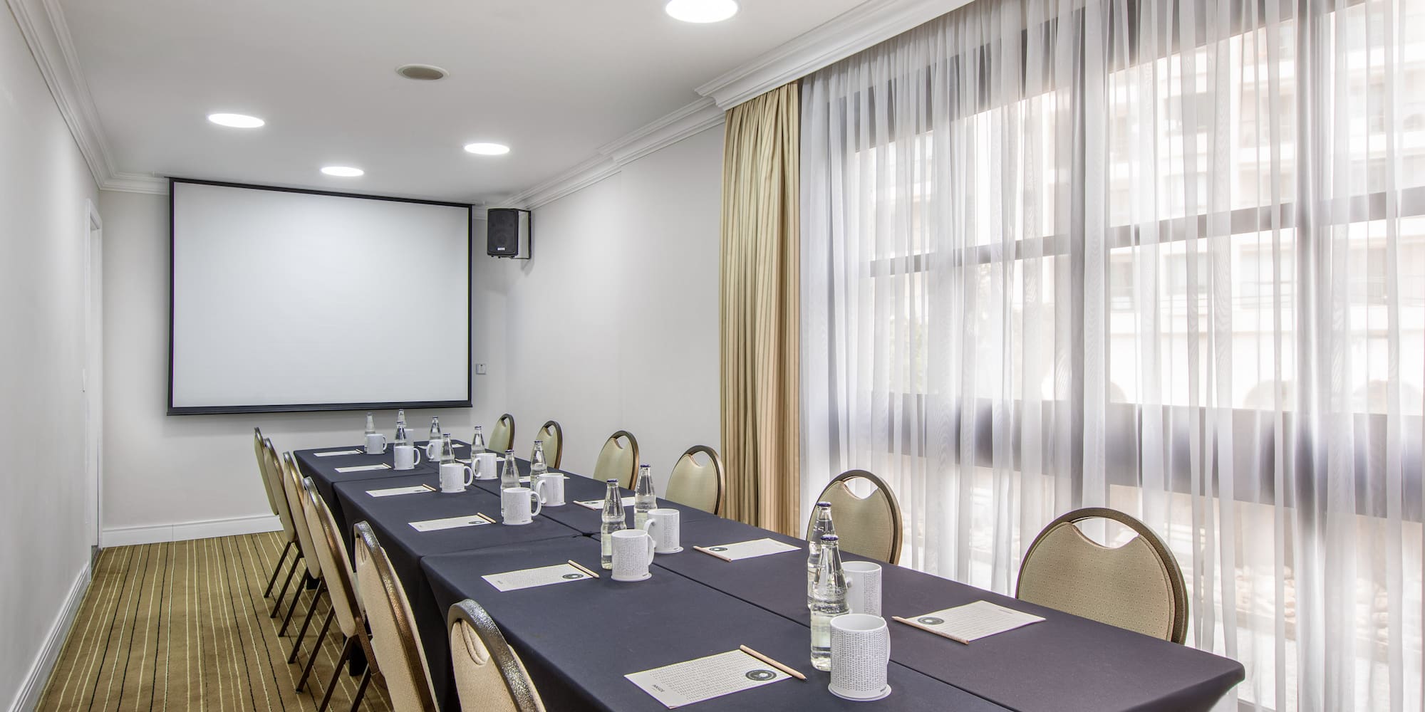 a room with a table and chairs