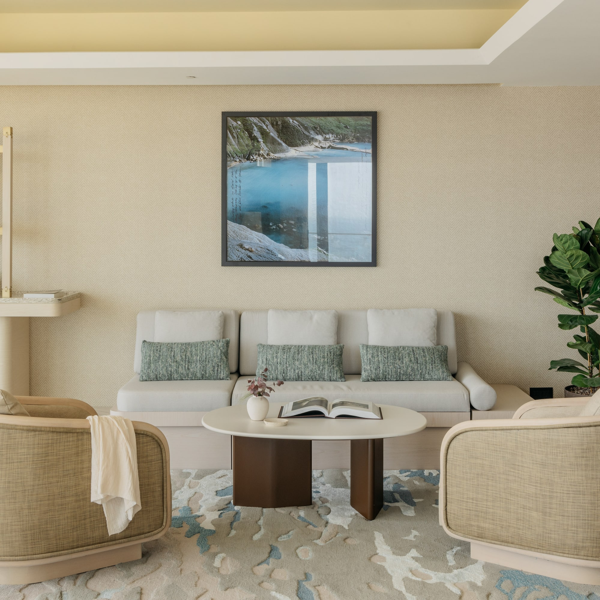 a room with a couch and a painting on the wall