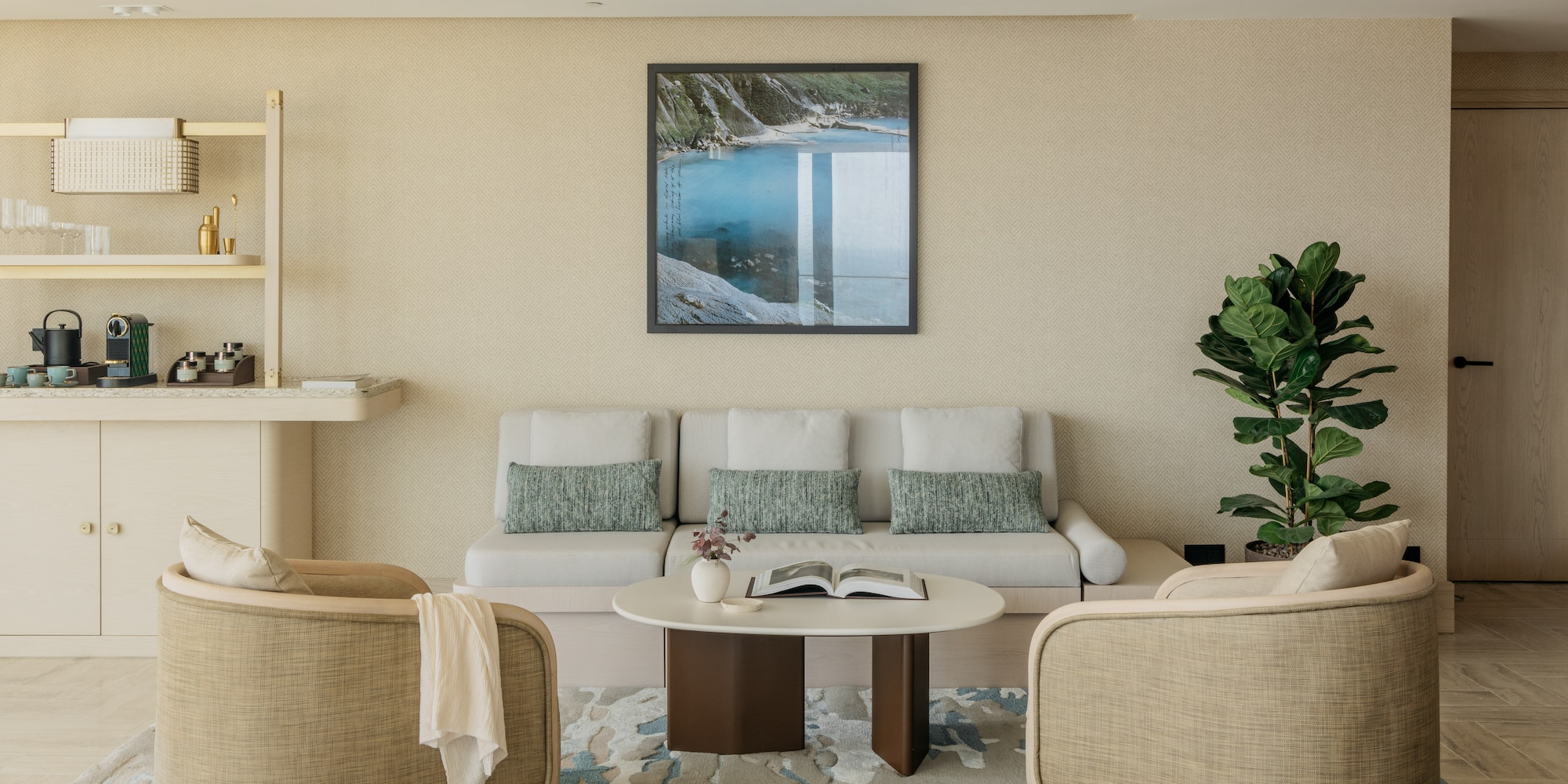 a room with a couch and a painting on the wall