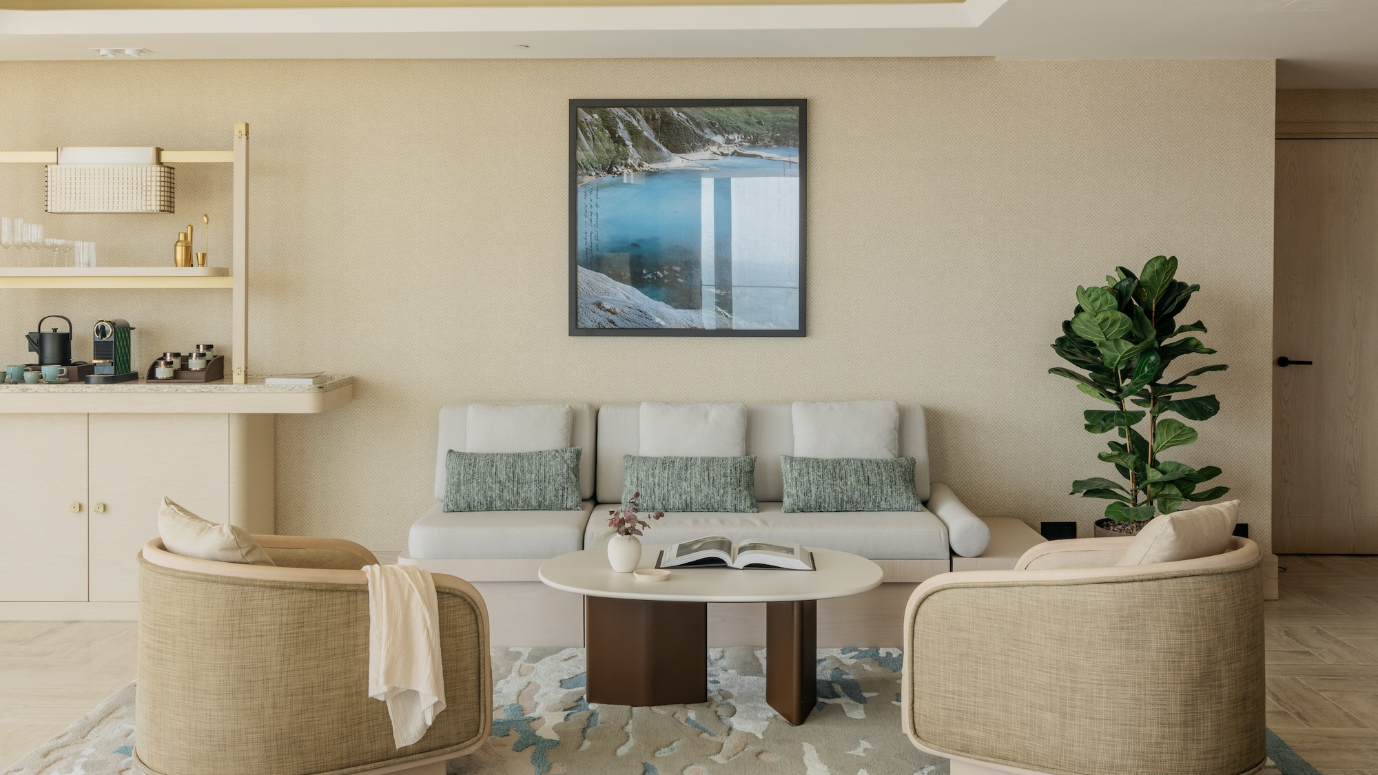 a room with a couch and a painting on the wall