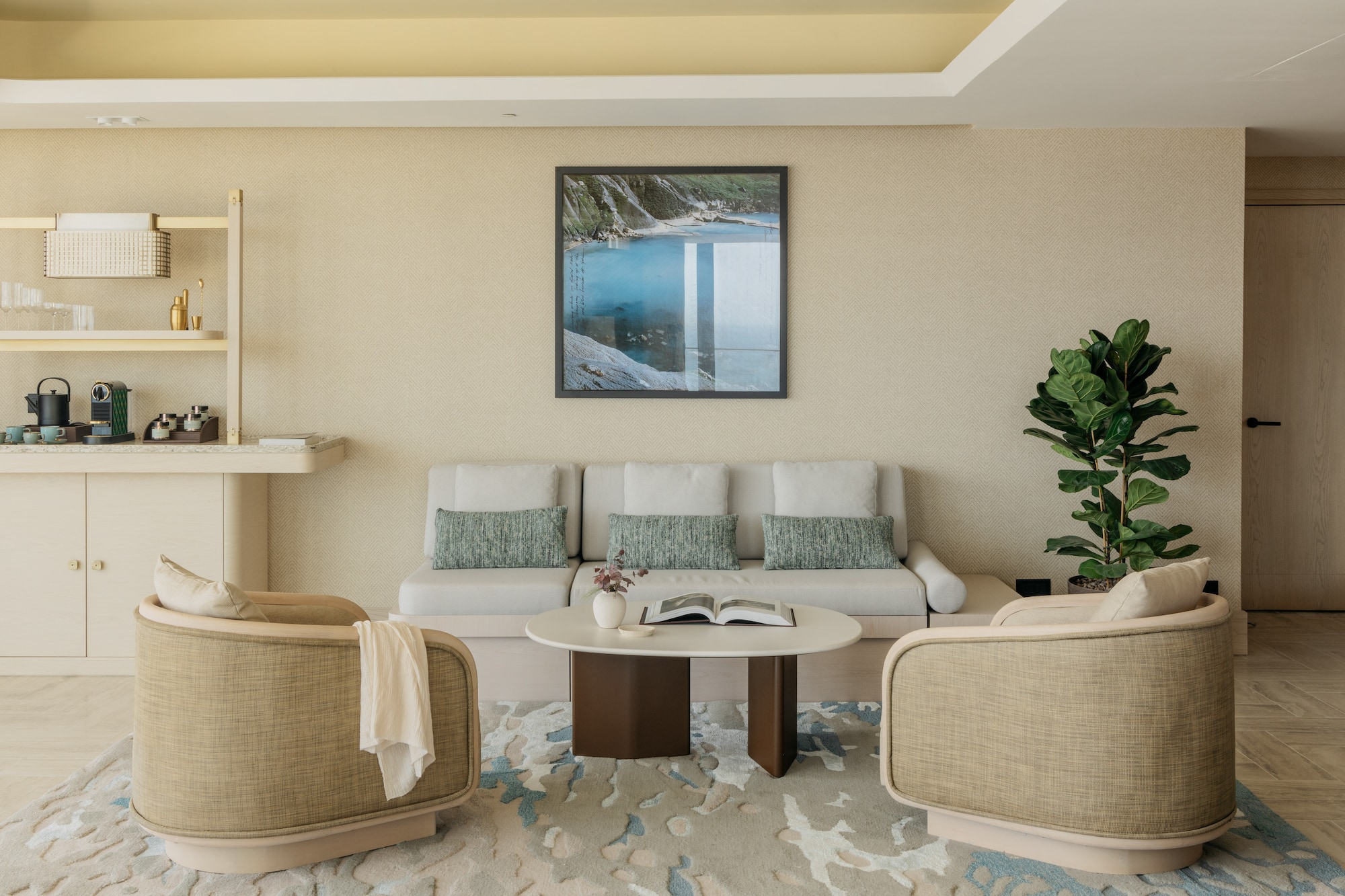 a room with a couch and a painting on the wall