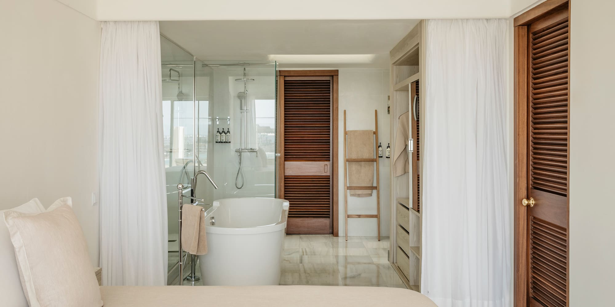 a bathroom with a bathtub and shower