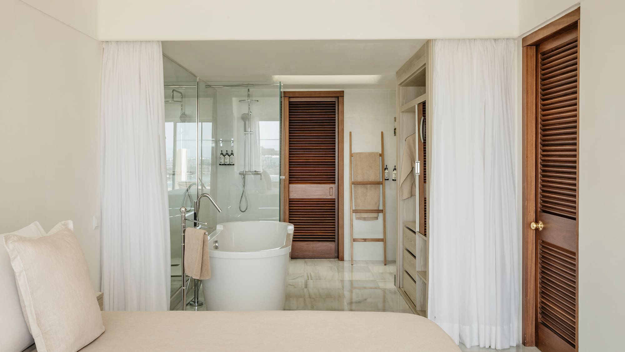 a bathroom with a bathtub and shower