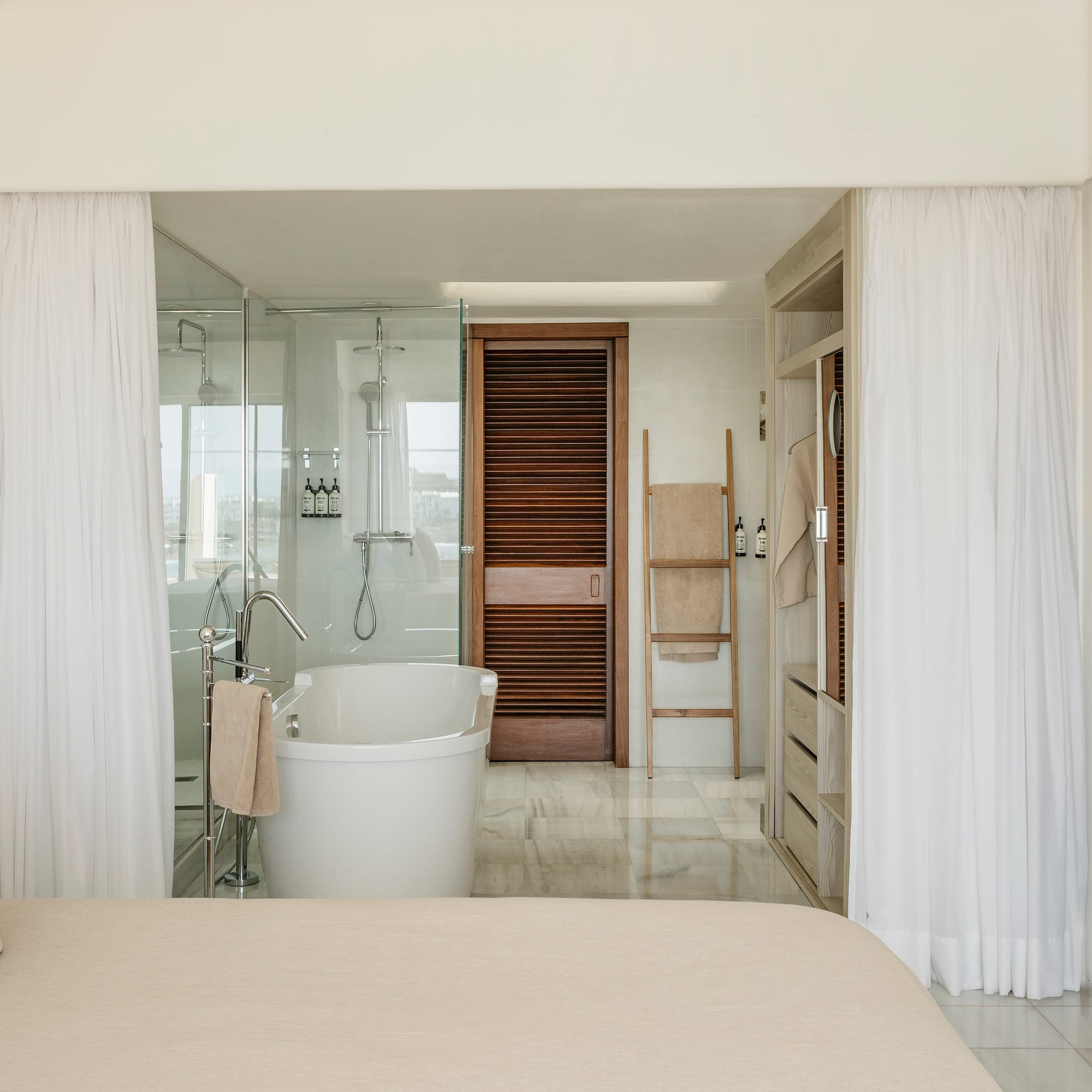 a bathroom with a bathtub and shower