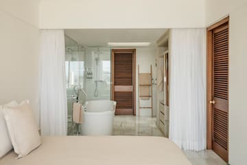 a bathroom with a bathtub and shower