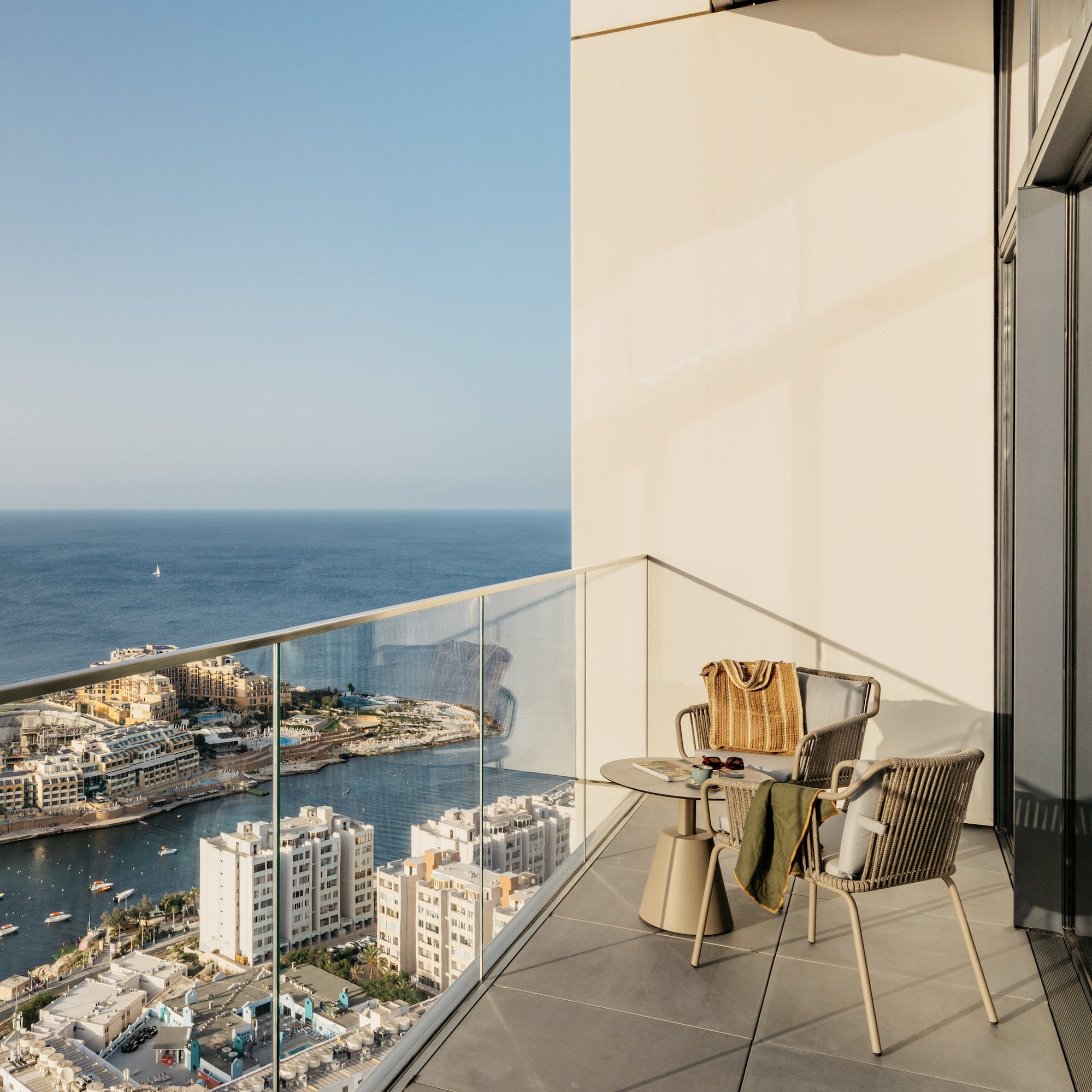 a balcony overlooking a city and water
