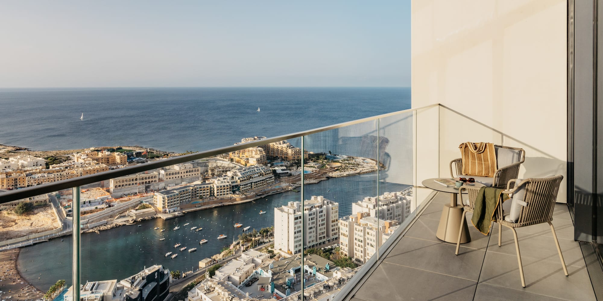 a balcony overlooking a city and water