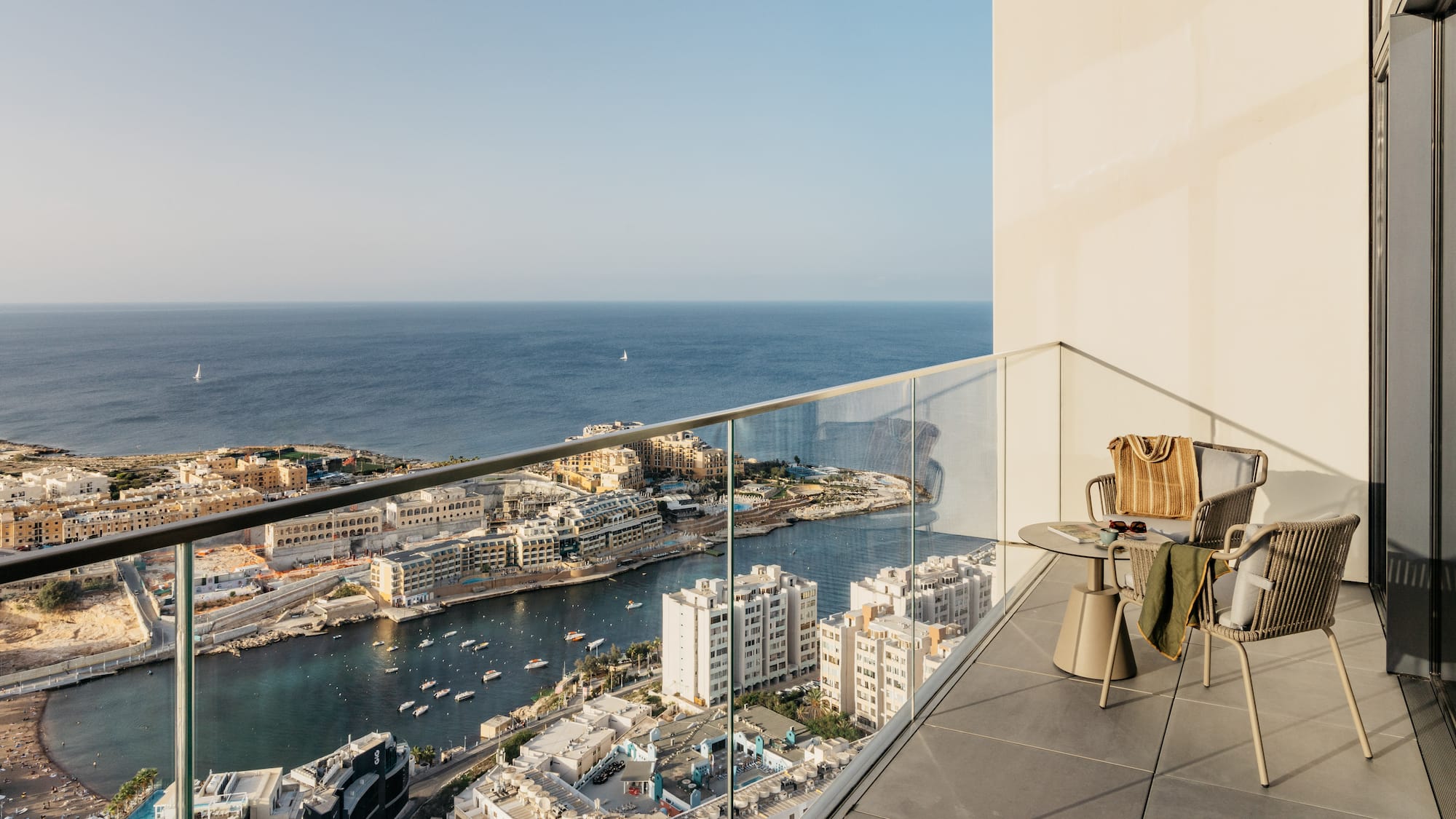 a balcony overlooking a city and water