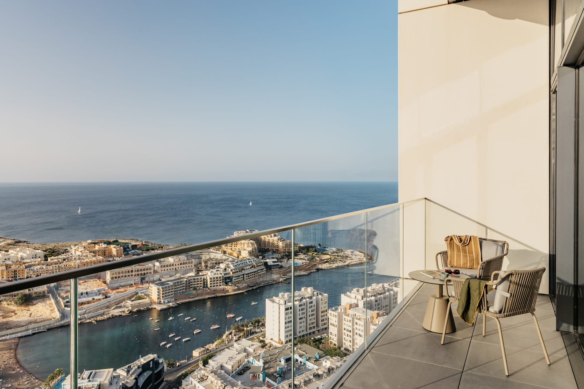 a balcony overlooking a city and water