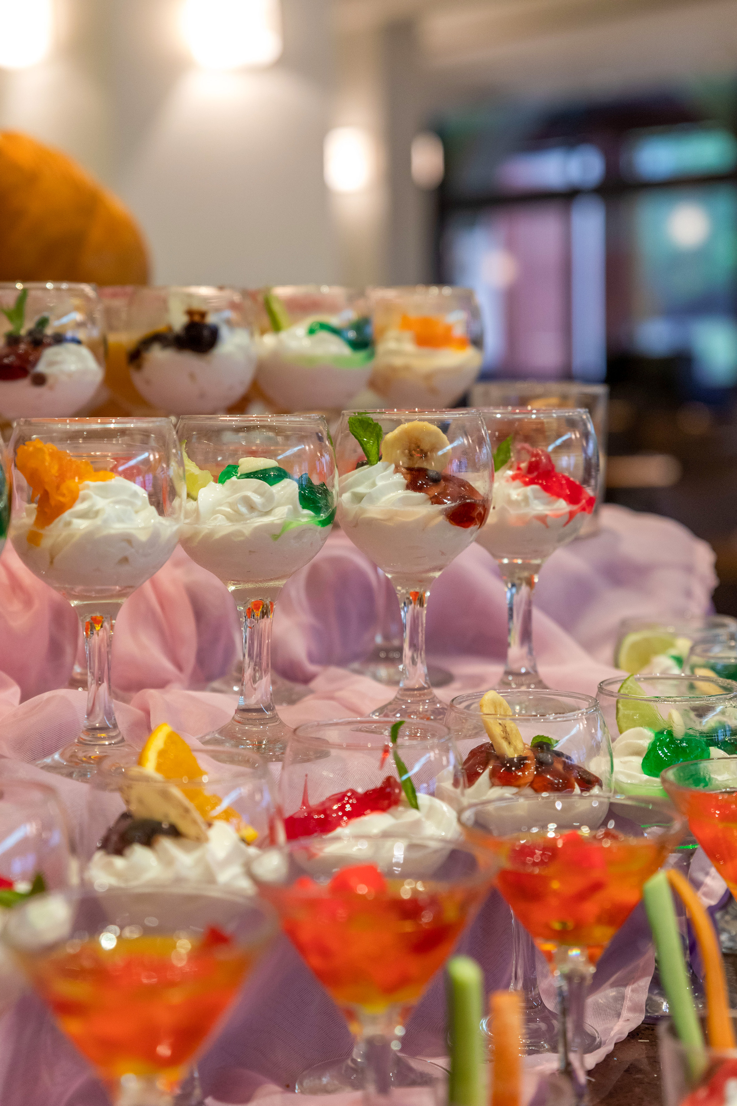 a group of glasses of desserts
