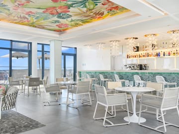 a room with tables and chairs