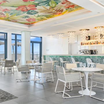 a room with tables and chairs