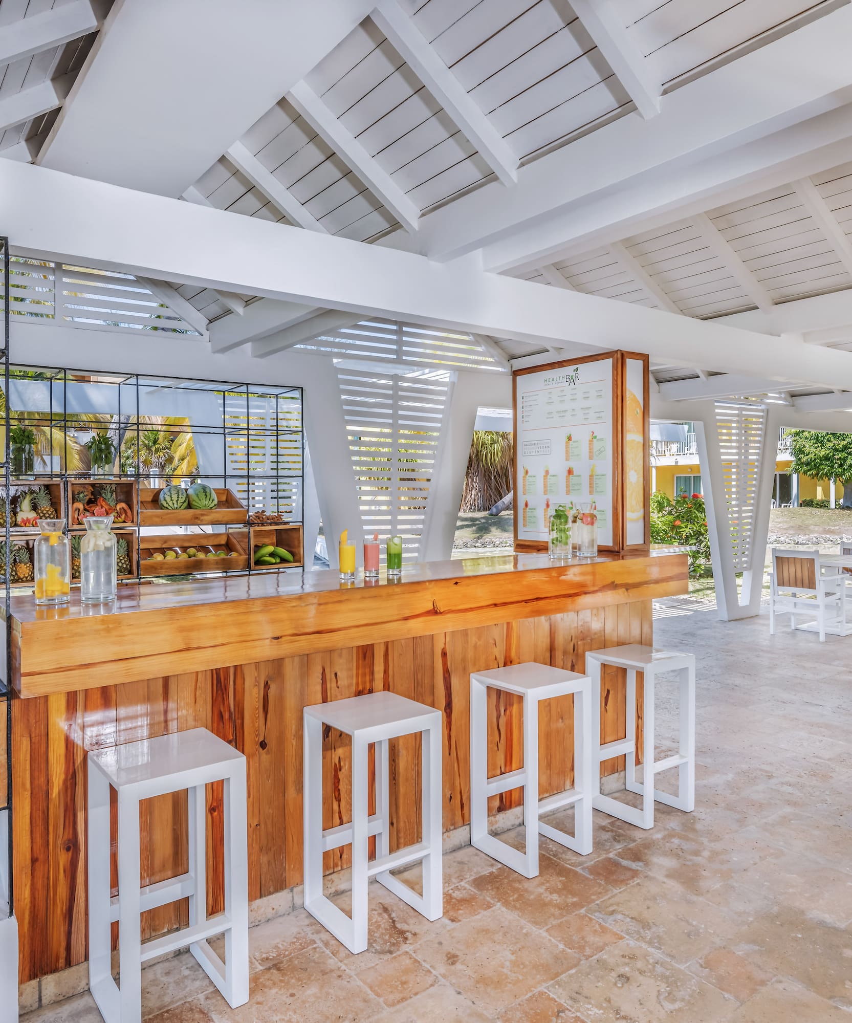 a room with a counter and stools