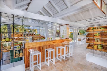a room with a counter and stools
