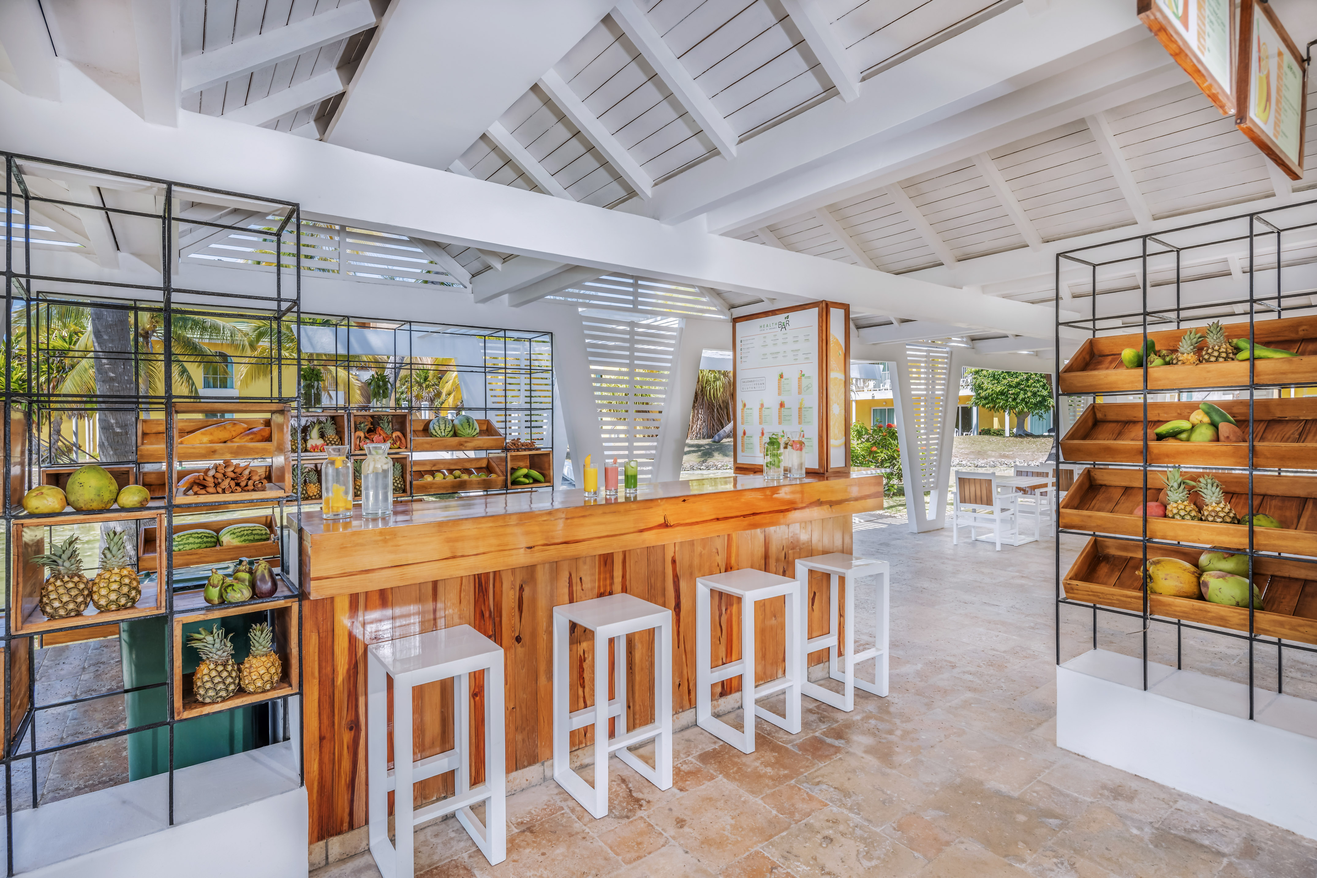 a room with a counter and stools