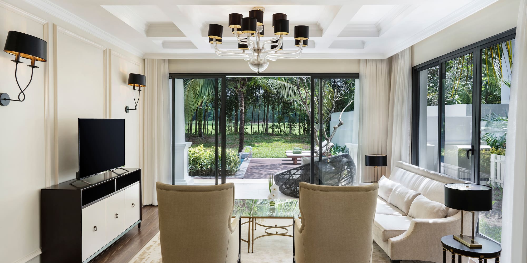 a living room with a television and couches