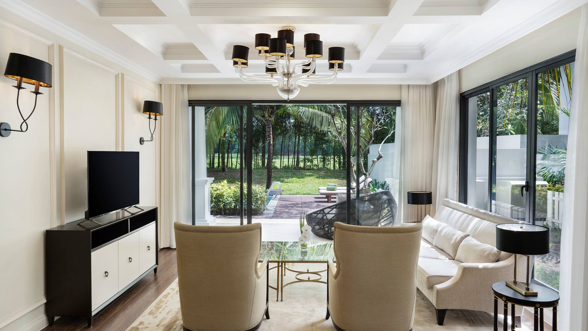 a living room with a television and couches