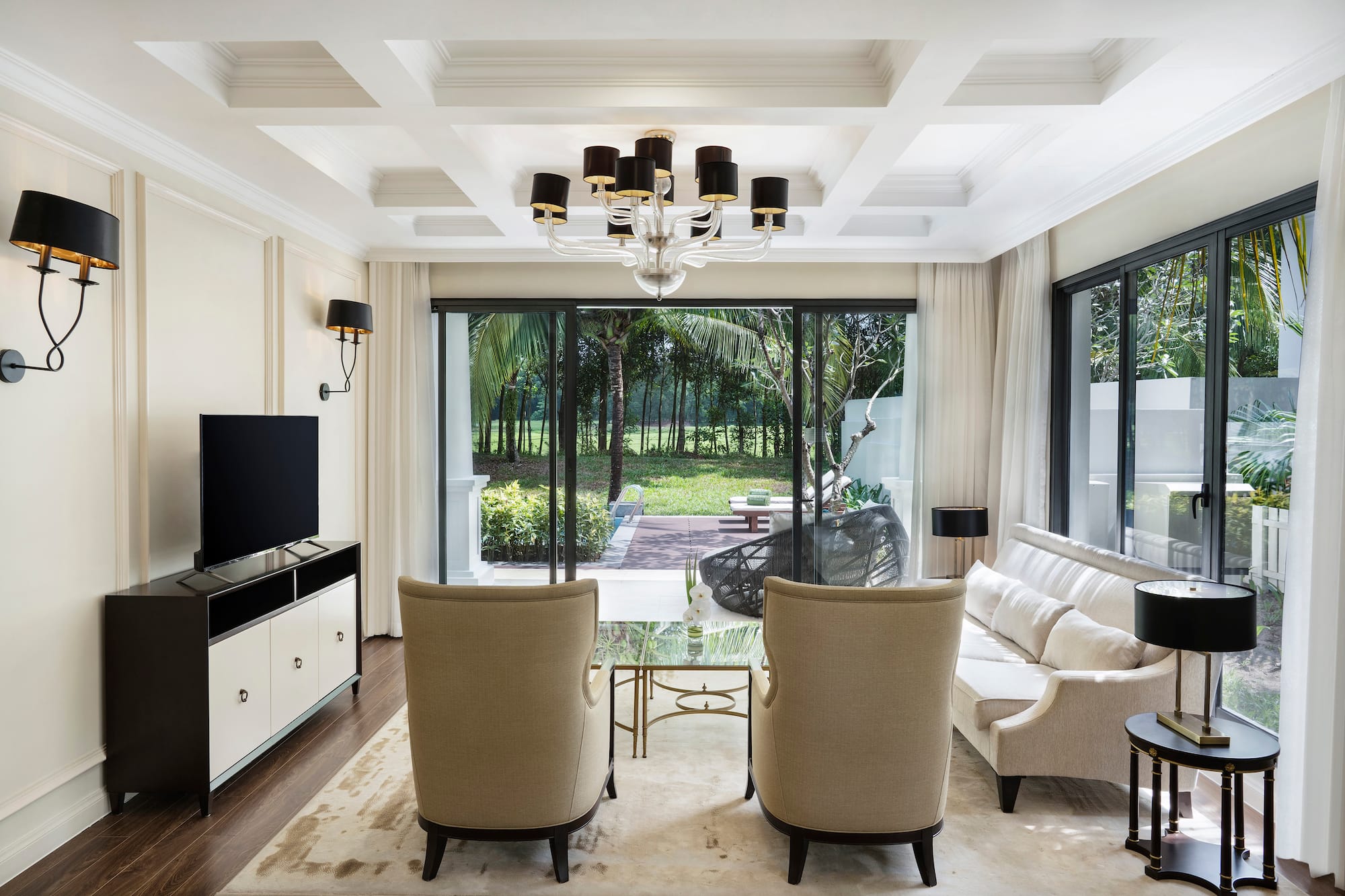 a living room with a television and couches