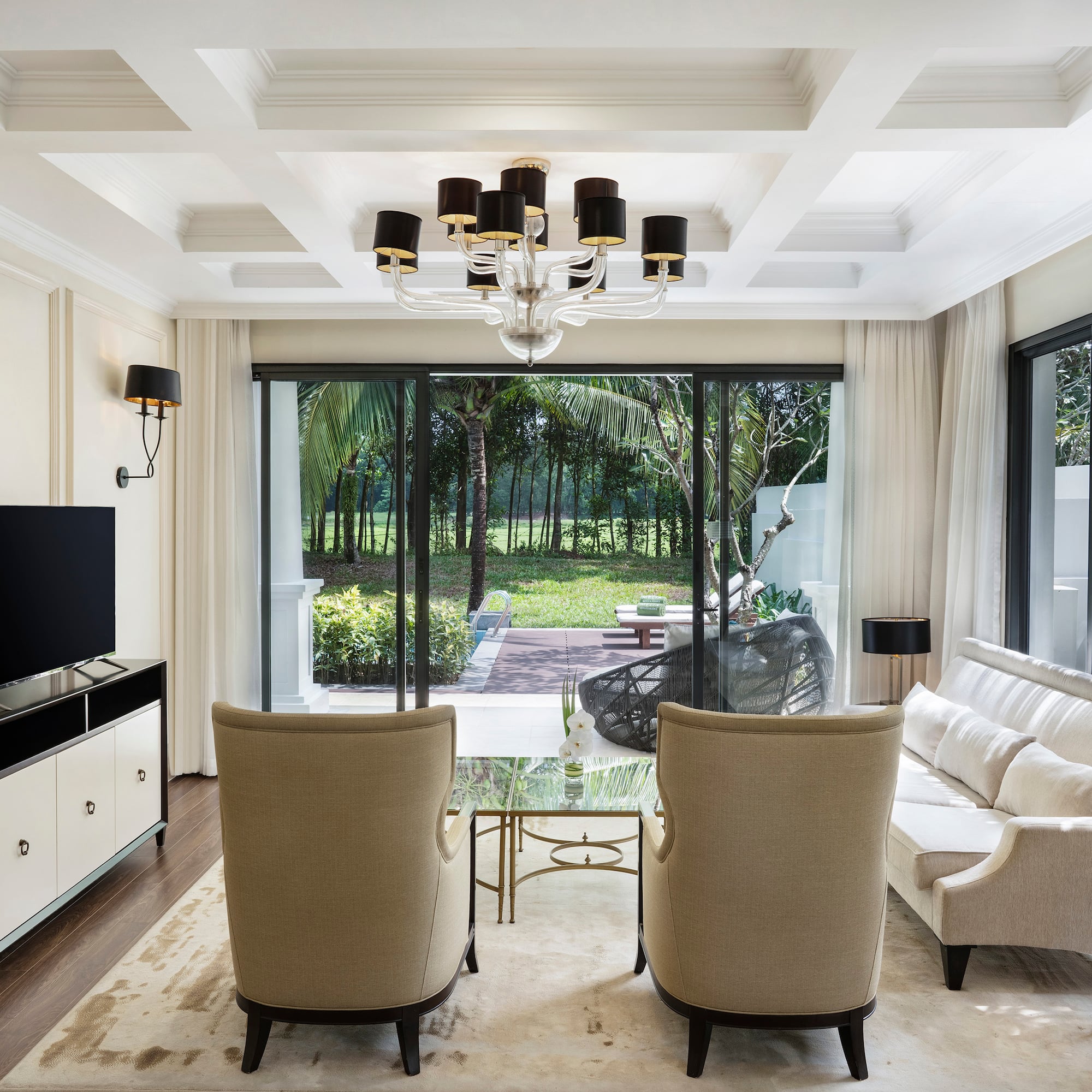 a living room with a television and couches