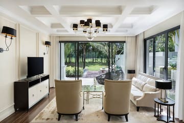 a living room with a television and couches
