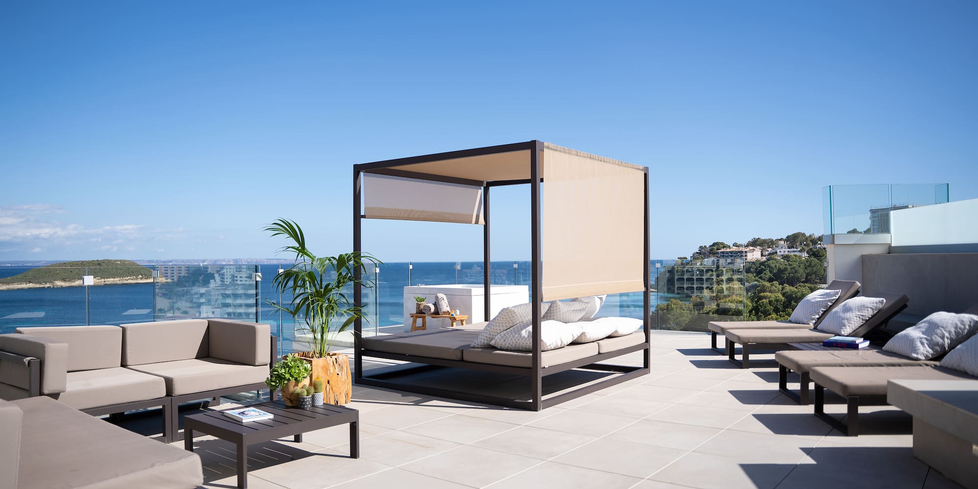 a patio with a canopy and chairs on a sunny day