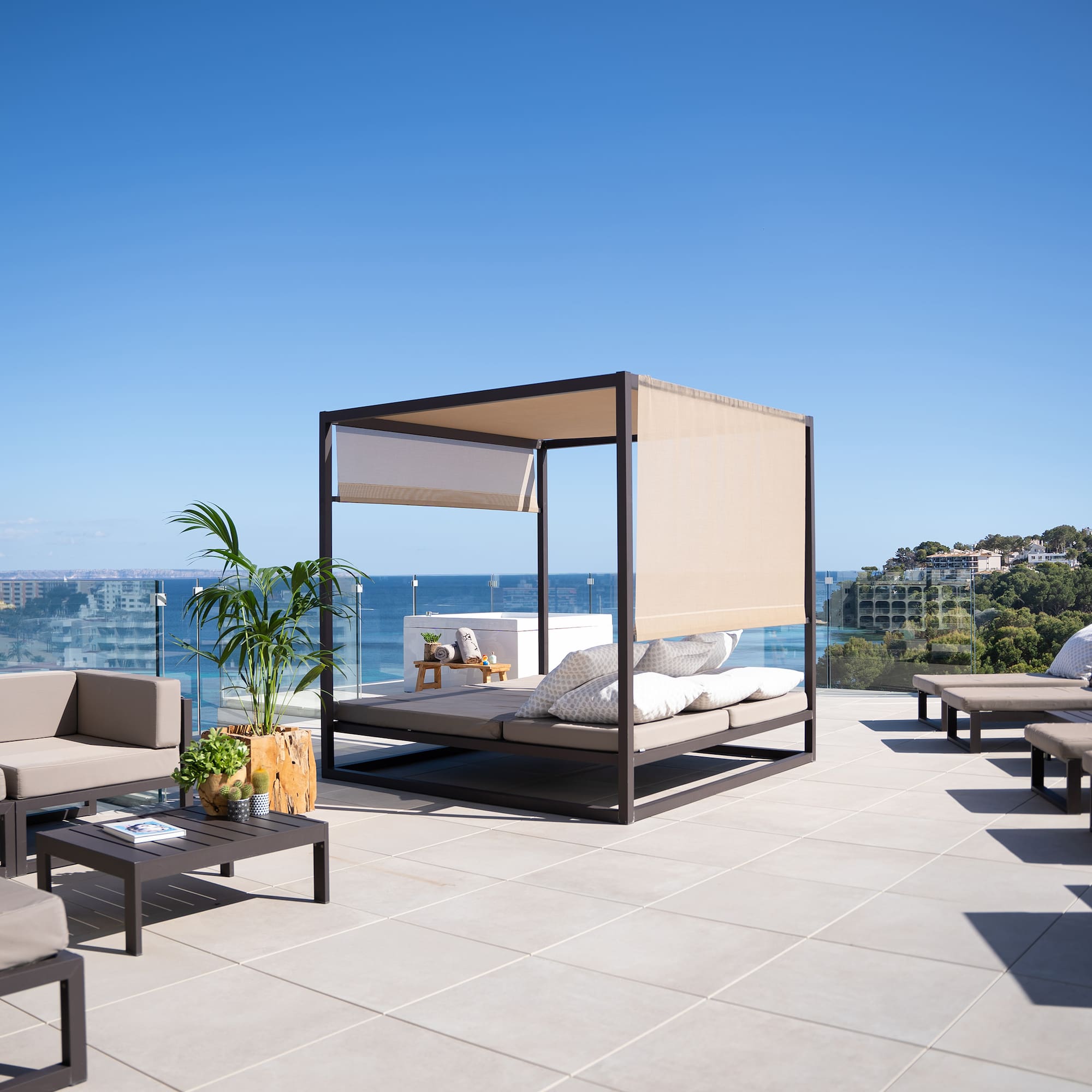 a patio with a canopy and chairs on a sunny day