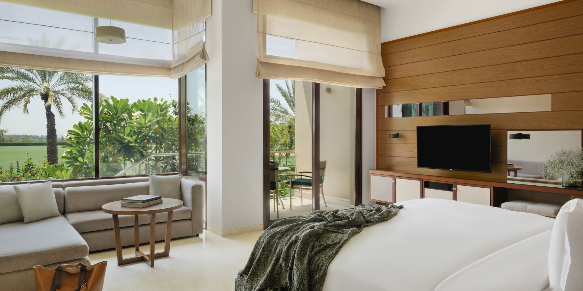 a bedroom with a television and a bed