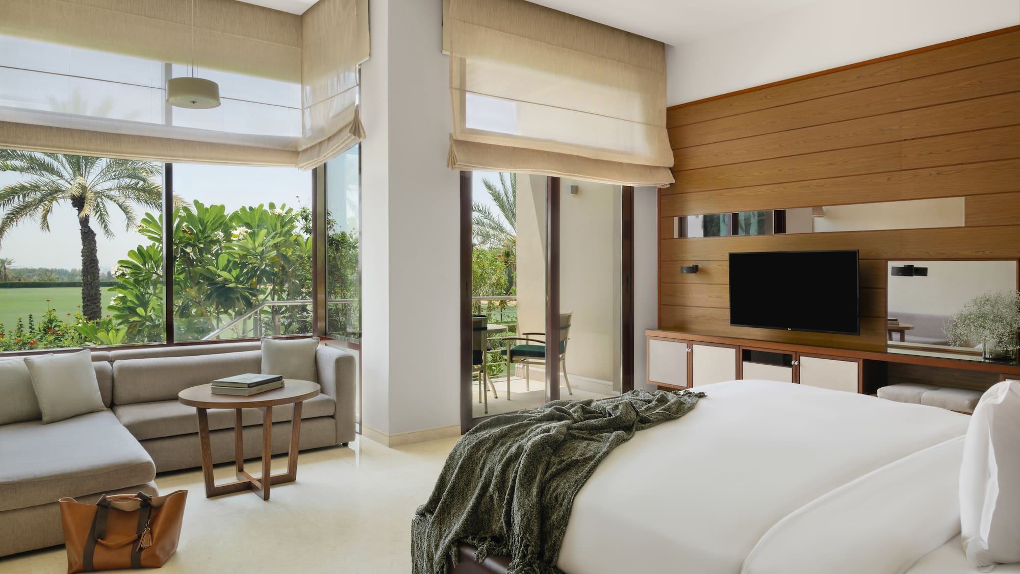 a bedroom with a television and a bed