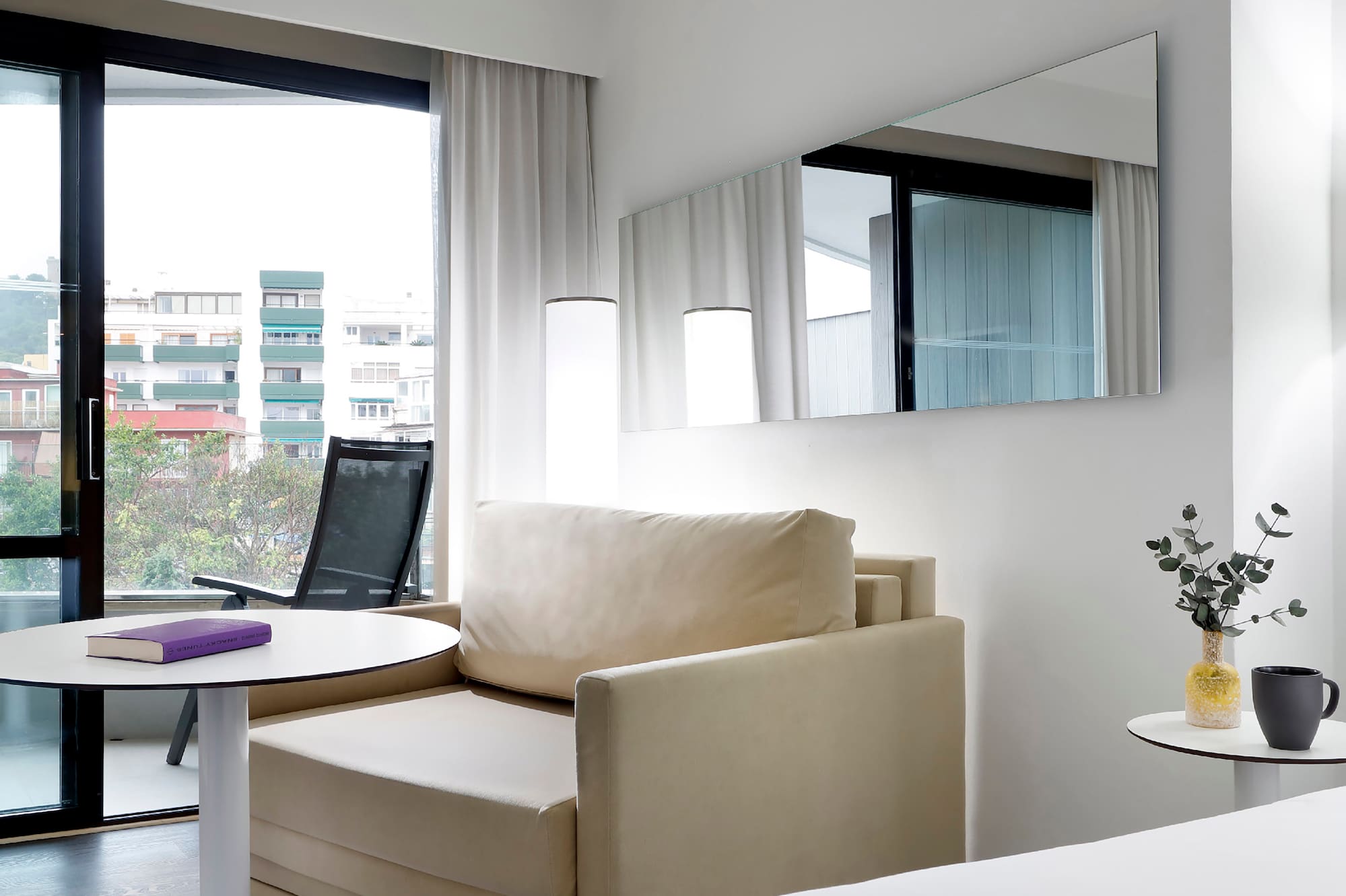 a room with a bed and a chair